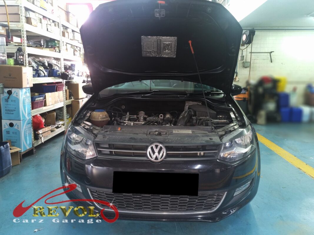 Volkswagen Polo with the engine bay open for thermostat replacement.