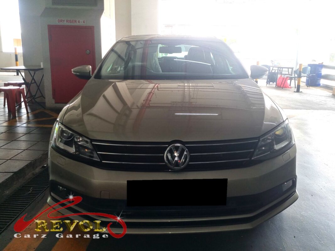 Volkswagen Jetta with the rear seat lifted for in-tank fuel pump access.