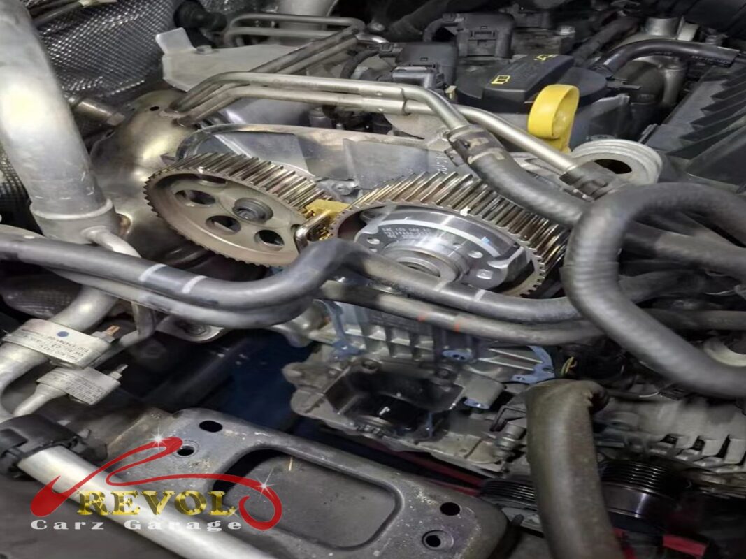 The timing covers off, the old belt and sprockets exposed for inspection.