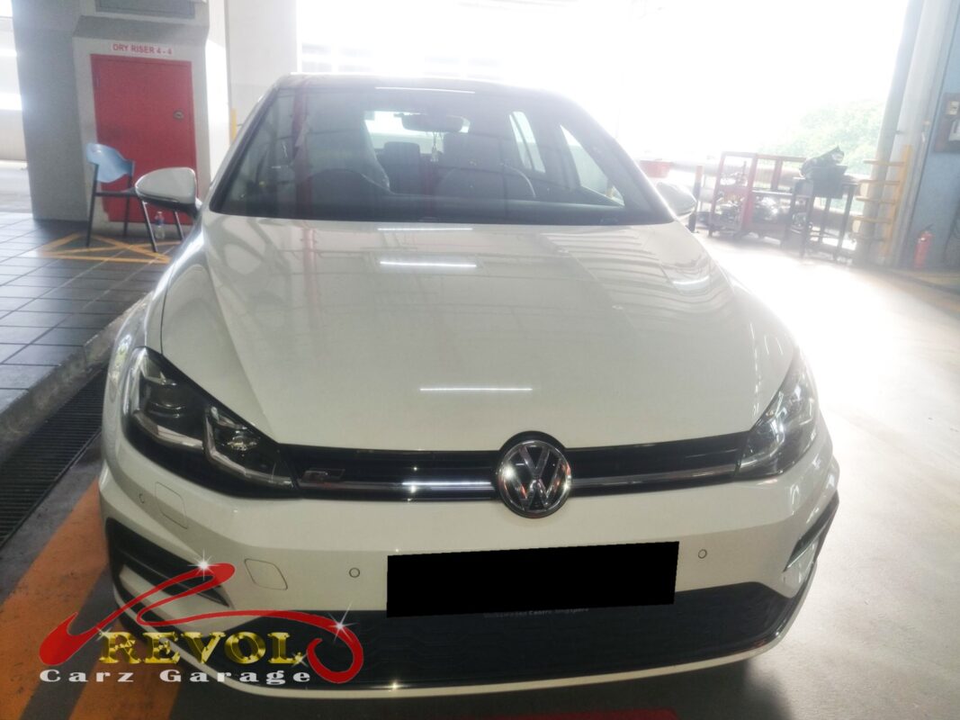 Volkswagen Golf with the engine bay open for oil separator cover replacement.