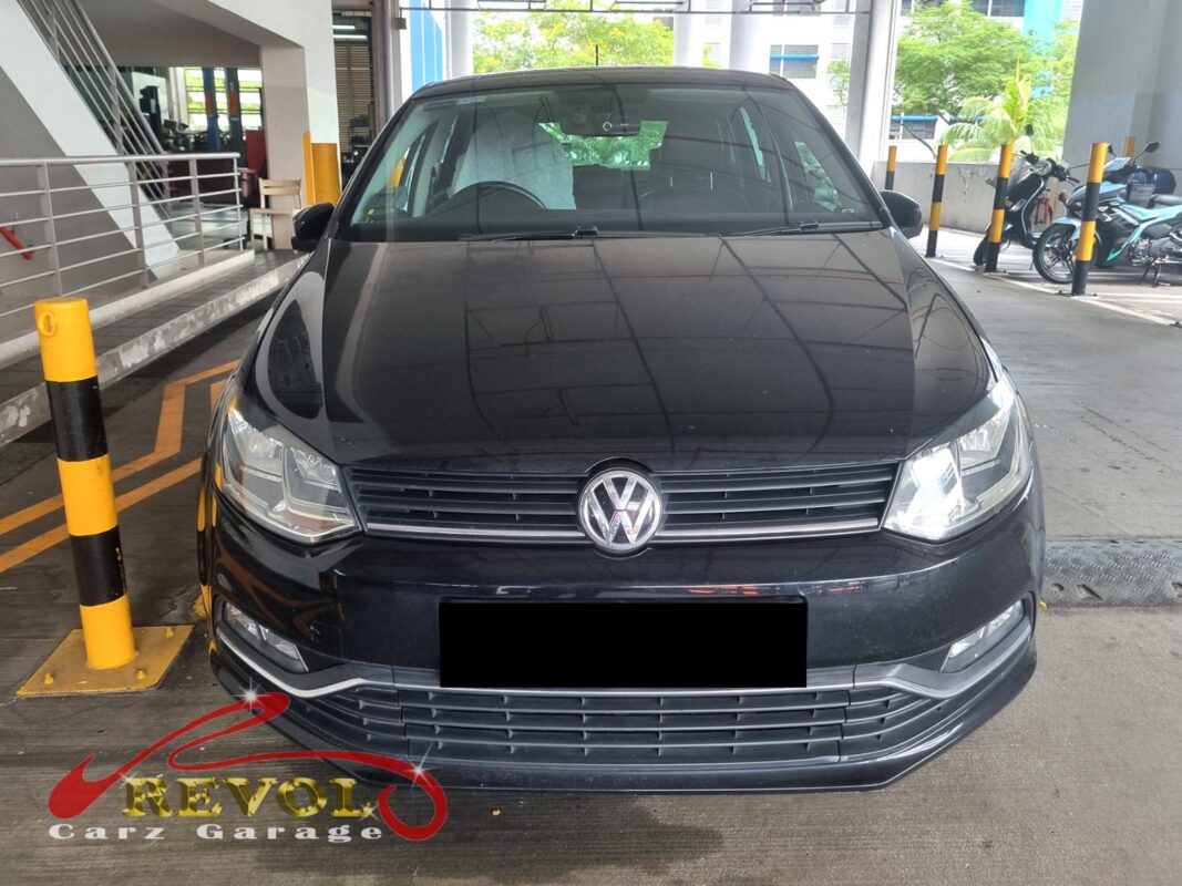 Volkswagen Polo in the workshop with the rear wheel off for ABS sensor diagnosis.