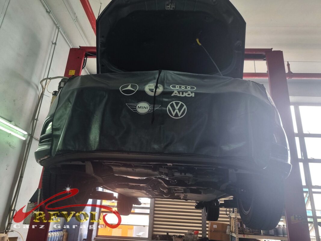 The Polo up on the two-post lift, front covered, in for the ABS sensor work.