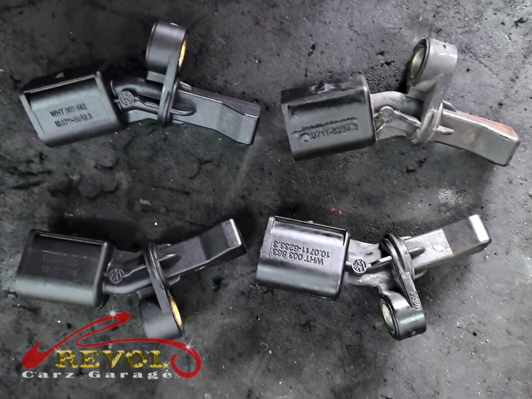 The wheel speed sensors that came off, laid out on the bench.