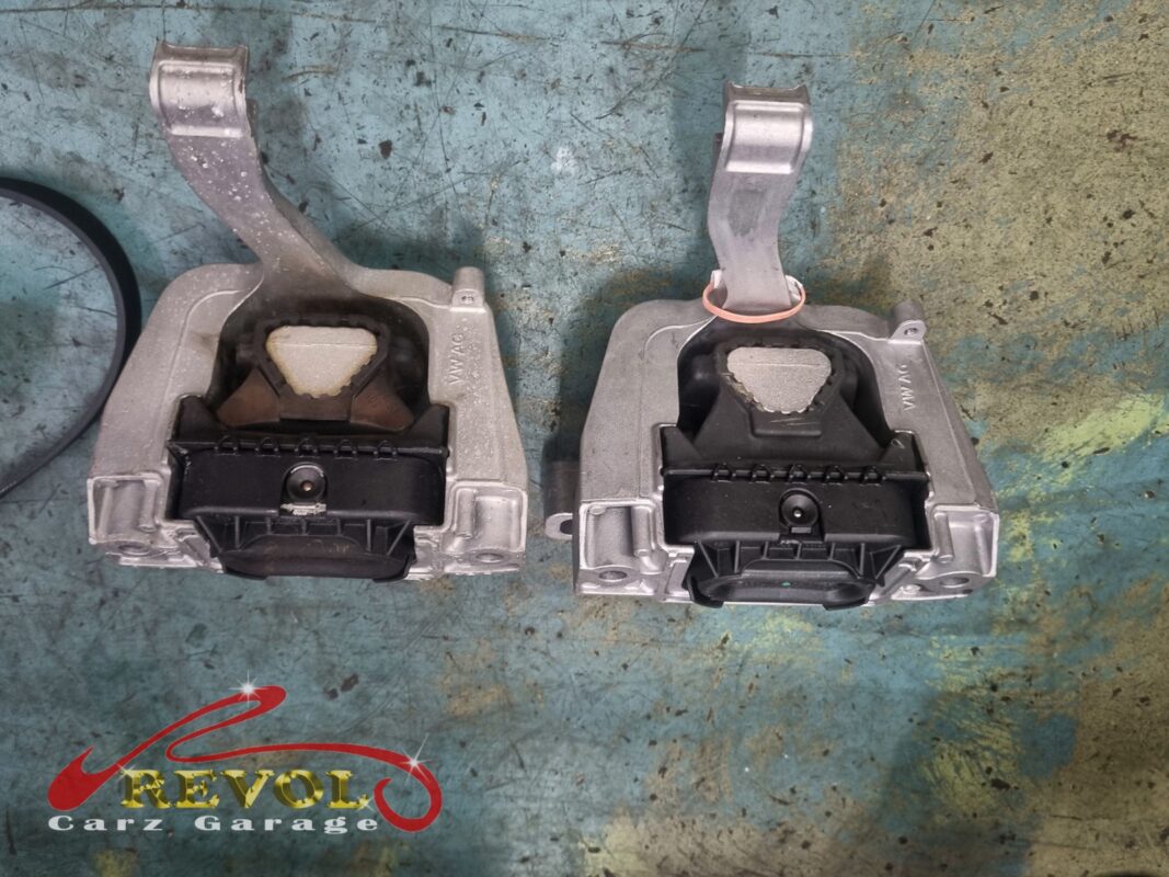 The old hydraulic mounts off the car, the engine mount and the gearbox mount, rubber sunk and split.