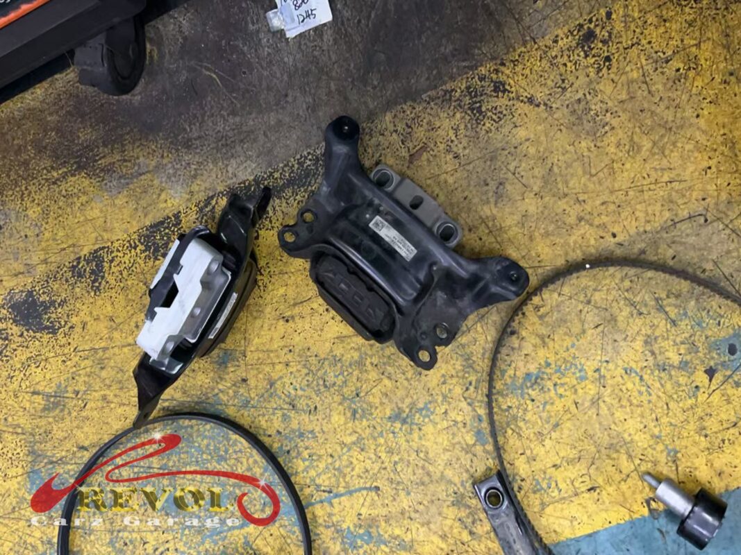 The gearbox mount and the lower torque link off the car.