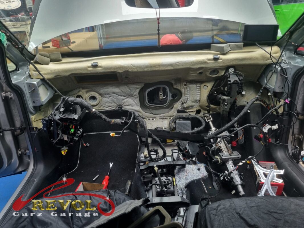 The dash stripped out, the HVAC box exposed to reach the evaporator core.