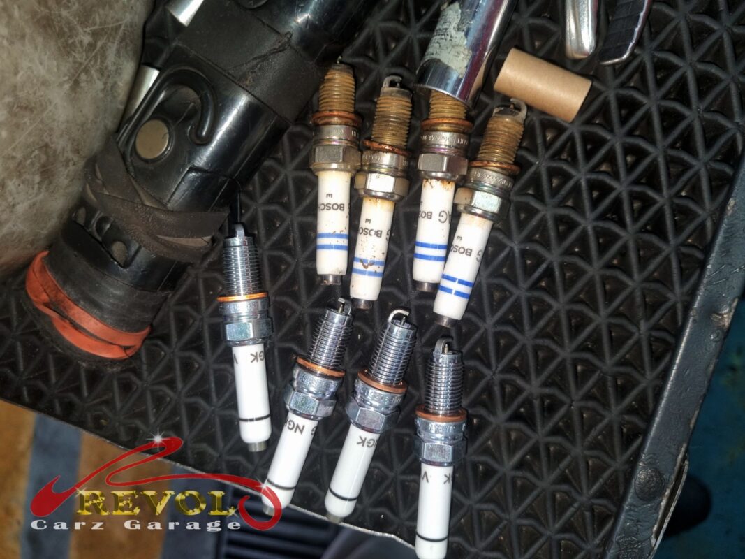 The four old Bosch plugs (top) beside the four new VAG-spec replacements (bottom).