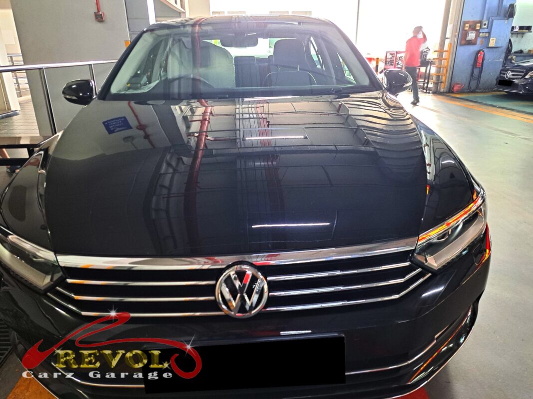 Volkswagen Passat with the front of the engine open for timing cover repair.