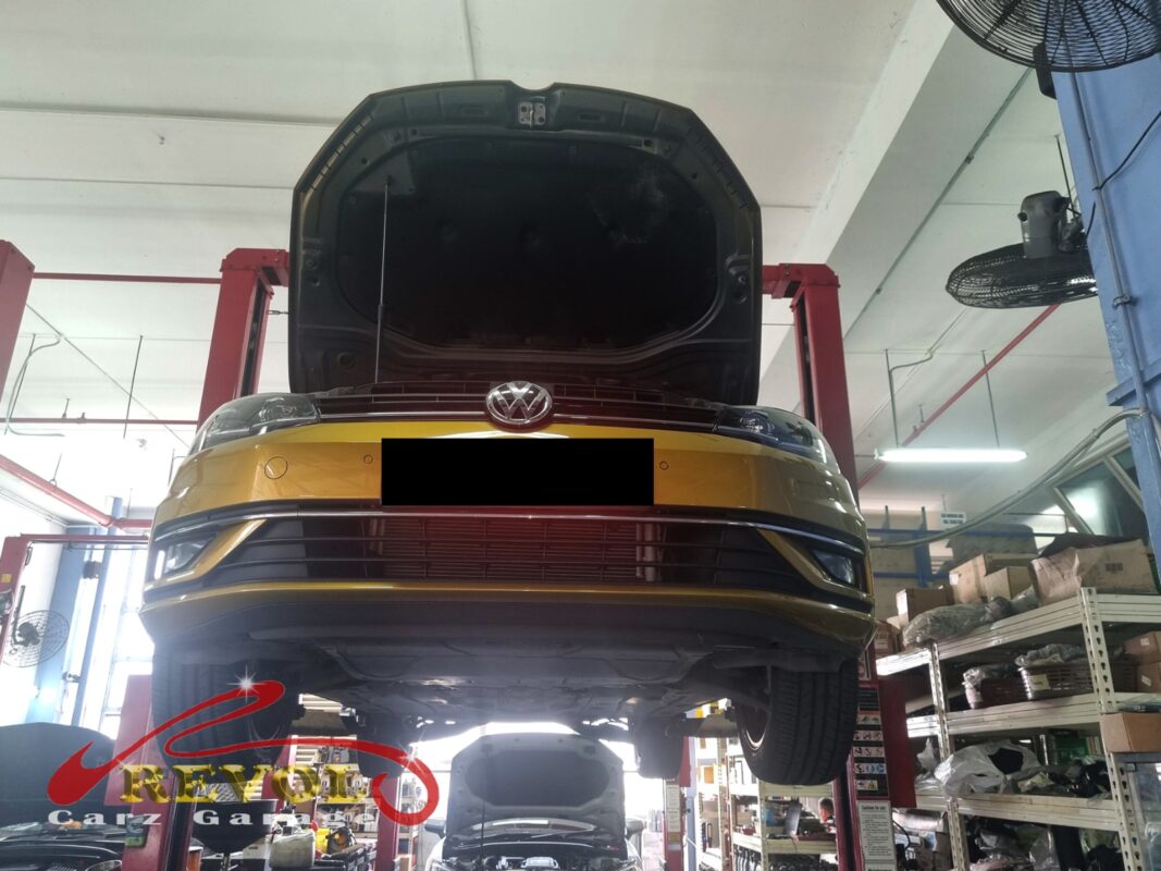 The Golf up on the two-post lift, bonnet open, in for the growl from the front.