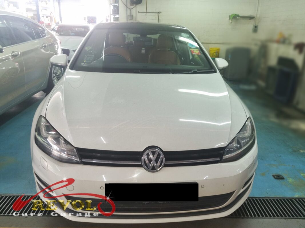 Volkswagen Golf with the under-dash trim removed for blower motor replacement.