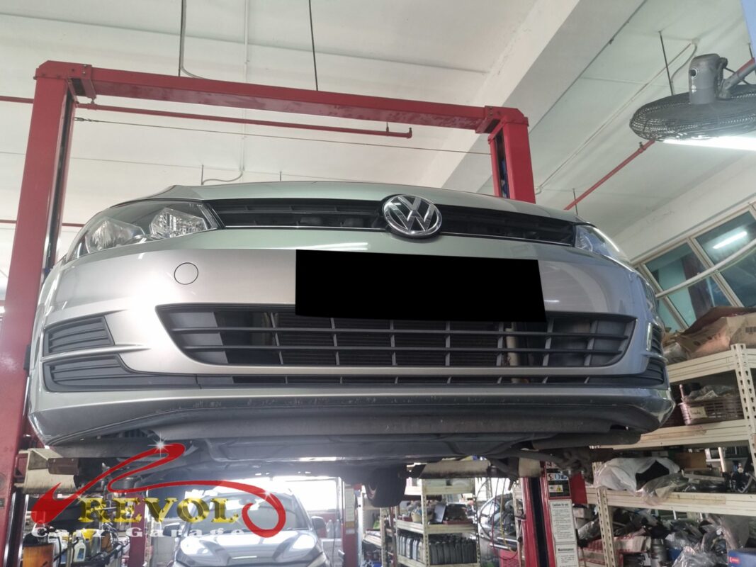 The Golf up on the two-post lift, bonnet open, in for the hum from the back.