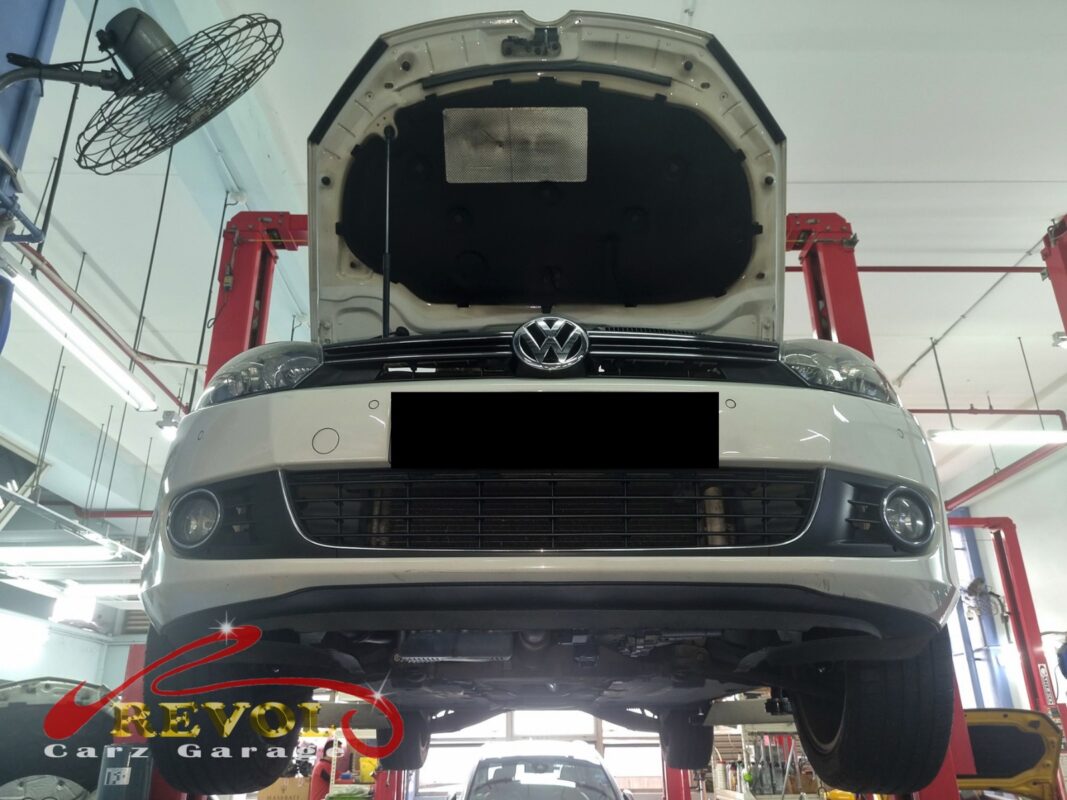 The Golf up on the two-post lift, bonnet open, in for the knock and the body roll.