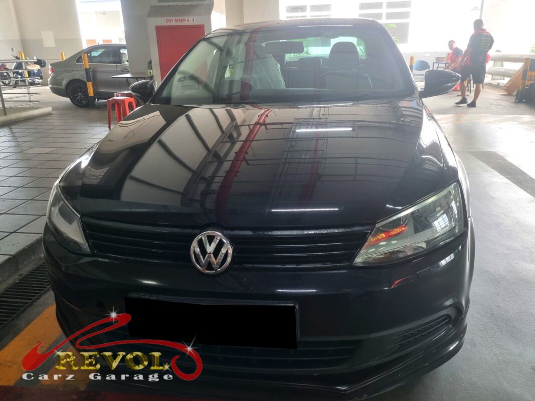 Volkswagen Jetta on the workshop lift for absorber linkage replacement.