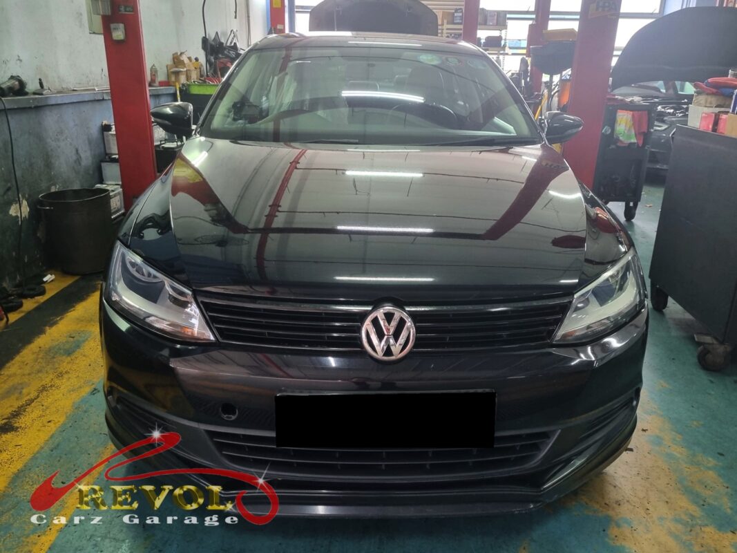 Volkswagen Jetta on the workshop lift for water pump replacement.
