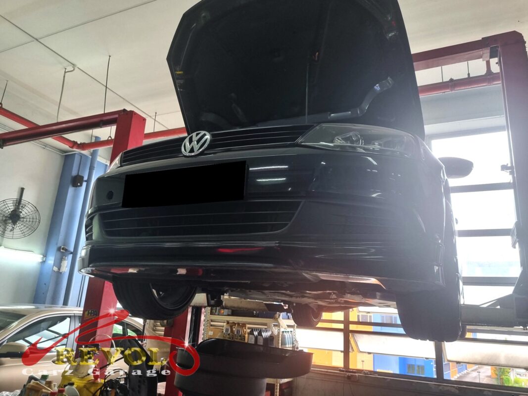 The Jetta up on the two-post lift, bonnet open, in for the coolant leak.