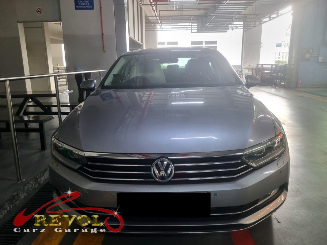 Volkswagen Passat with the engine bay open for cooling system pressure test.