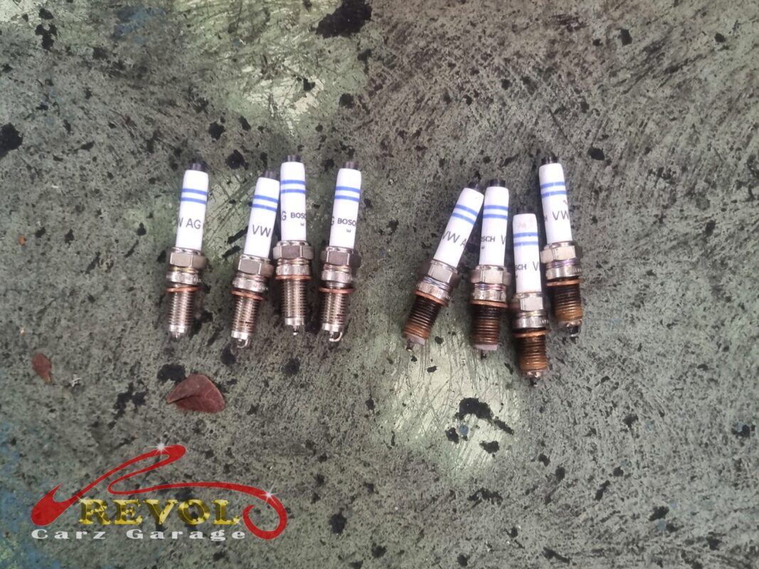 The four old plugs (right) beside the four new VAG-spec replacements (left), genuine VW set.