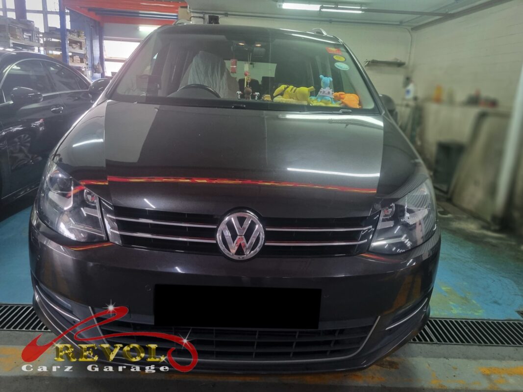 Volkswagen Sharan on the workshop lift for radiator replacement.