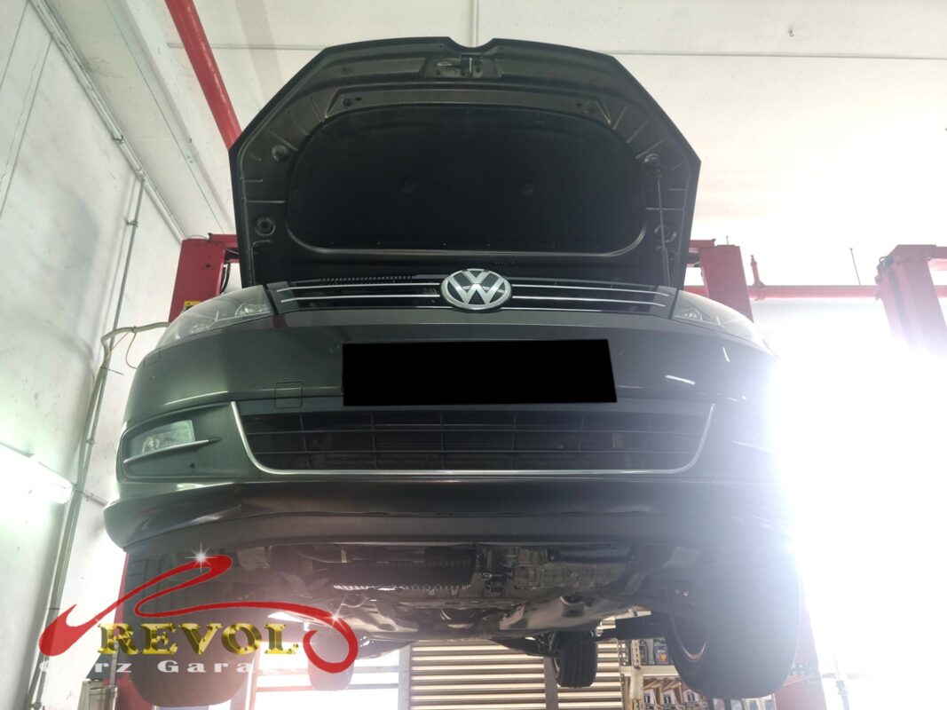 The Sharan up on the two-post lift, bonnet open, in for the coolant leak and the climbing gauge.