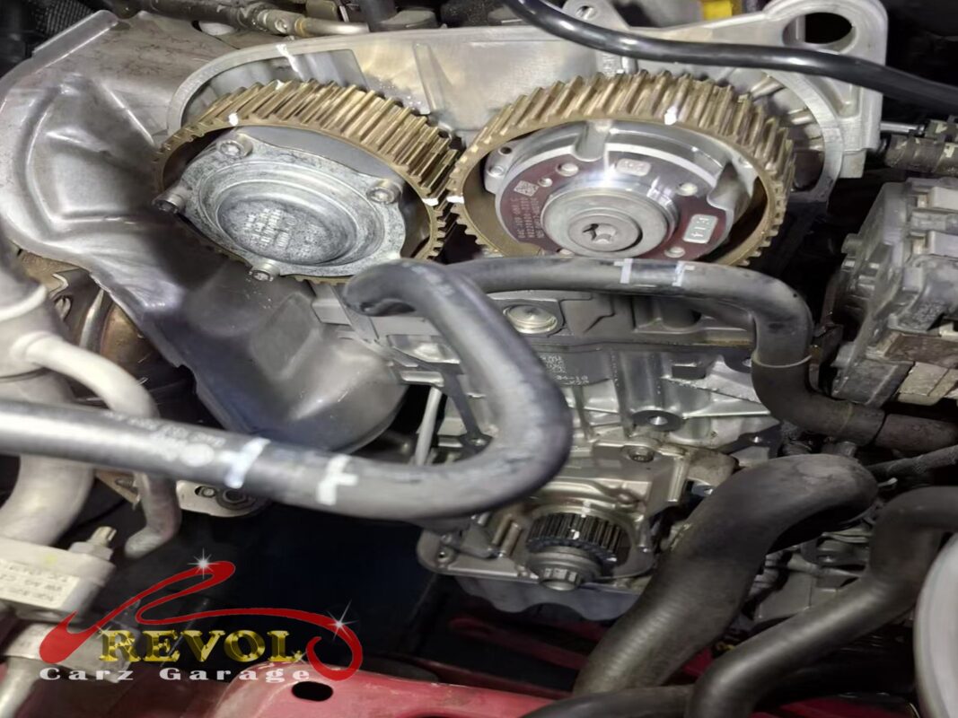 The timing covers off, the old belt and sprockets exposed for inspection.