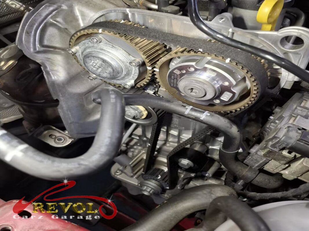 The new belt fitted on the cam sprockets, the timing set before the covers go back on.