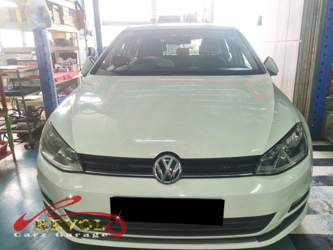 Volkswagen Golf with the throttle body removed for replacement.