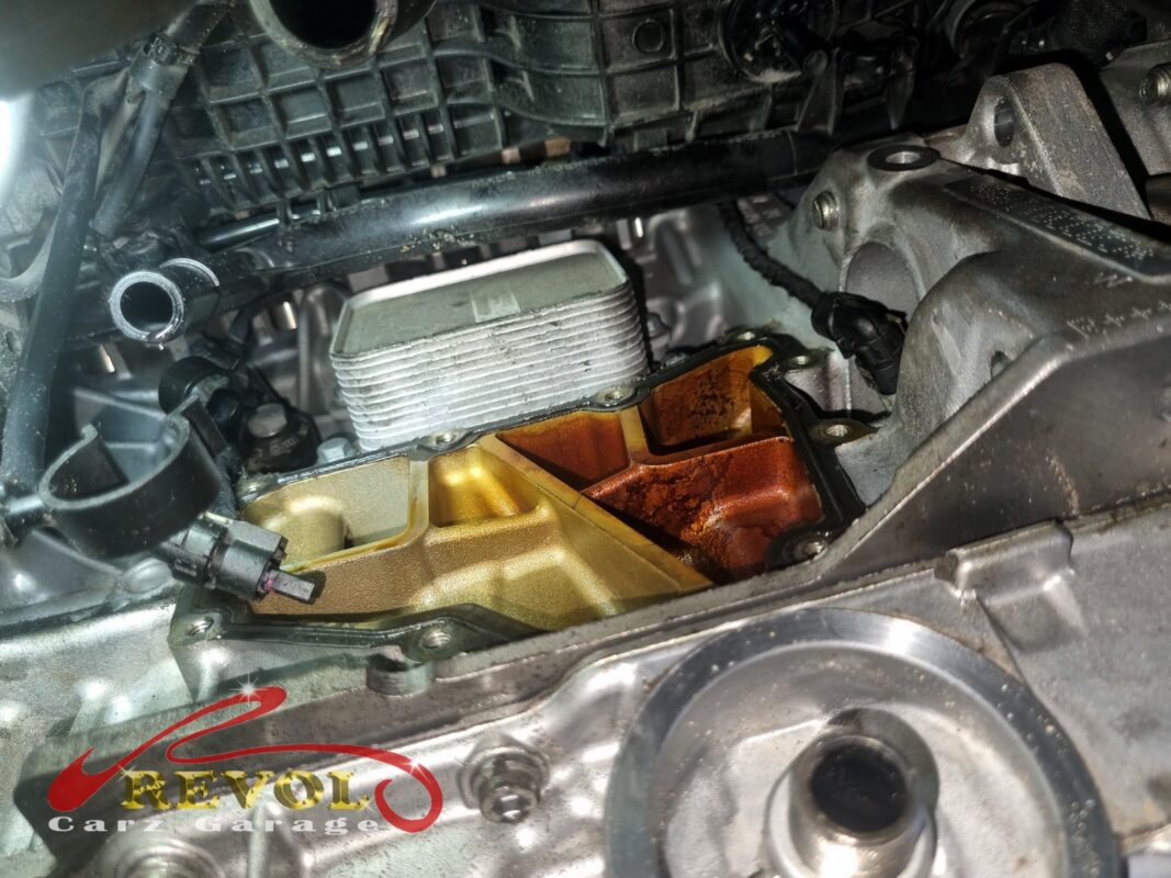 The oil separator cover off, the block cavity and oil cooler exposed.