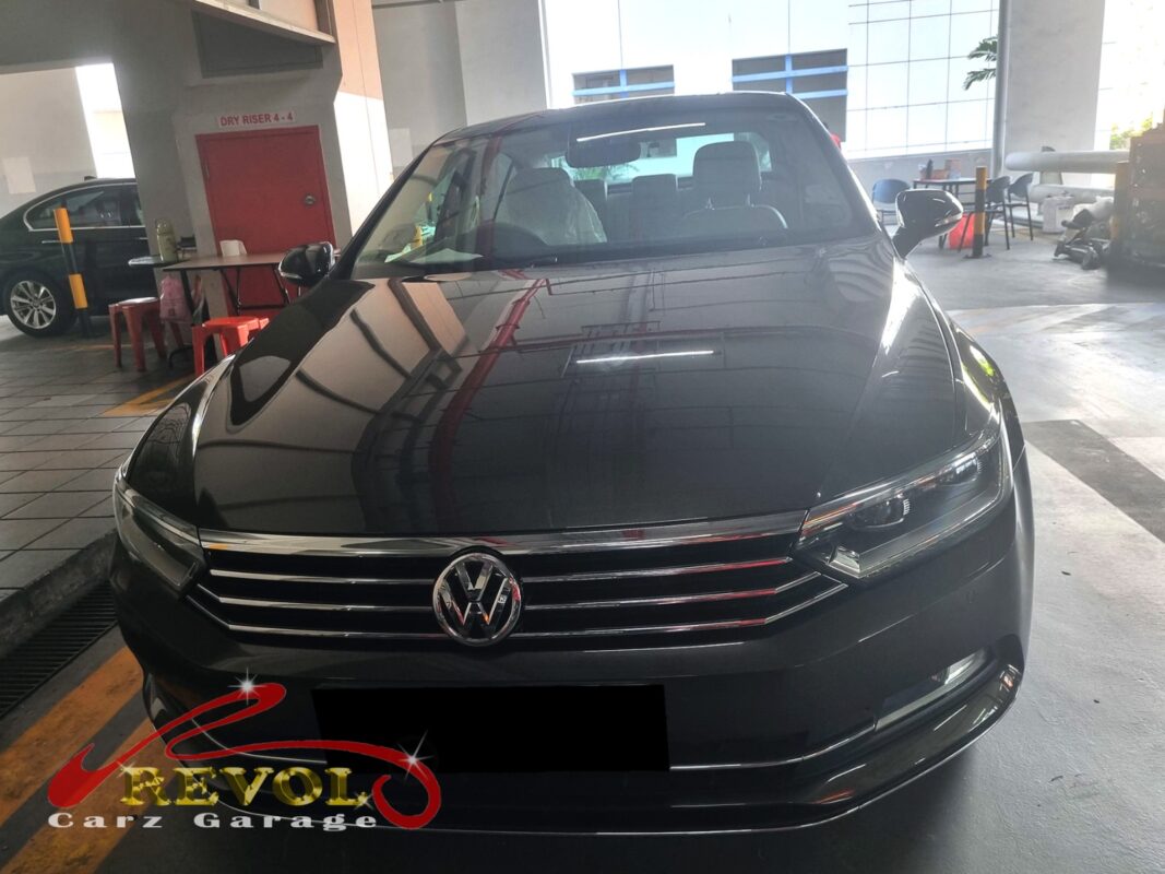 Volkswagen Passat on the workshop lift for water pump and thermostat replacement.