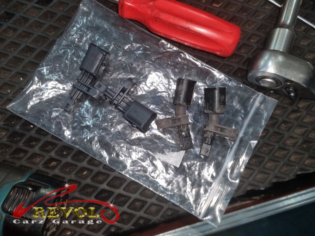 Wheel speed sensors removed and bagged, the failed front one among them.