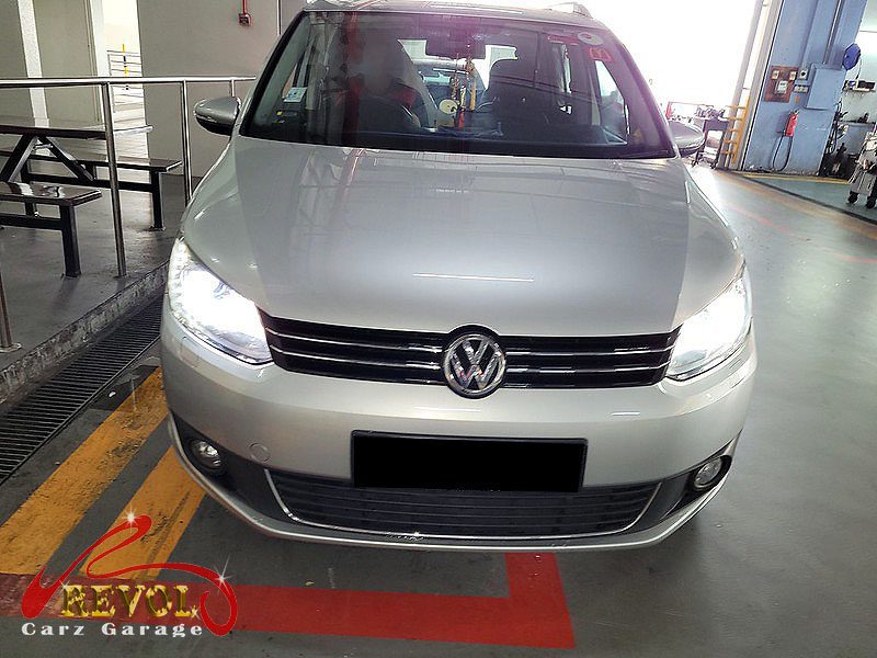Volkswagen Touran parked at the workshop for servicing.