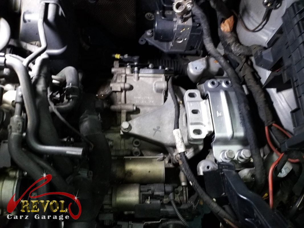 The old perished, cracking coolant hoses removed.