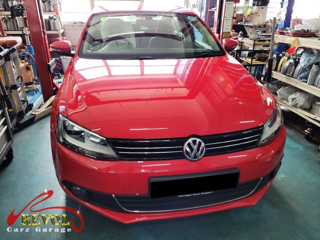Volkswagen Jetta parked at the workshop for maintenance servicing.