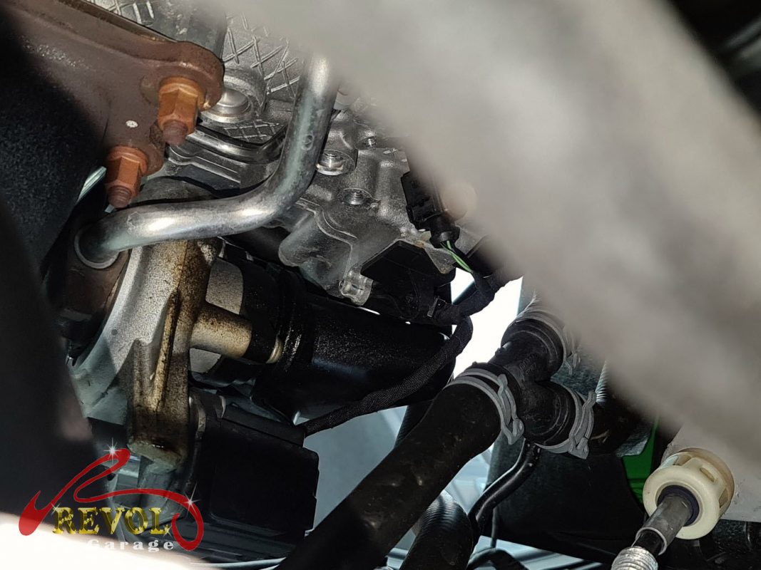 The old water pump and thermostat housing assembly removed.