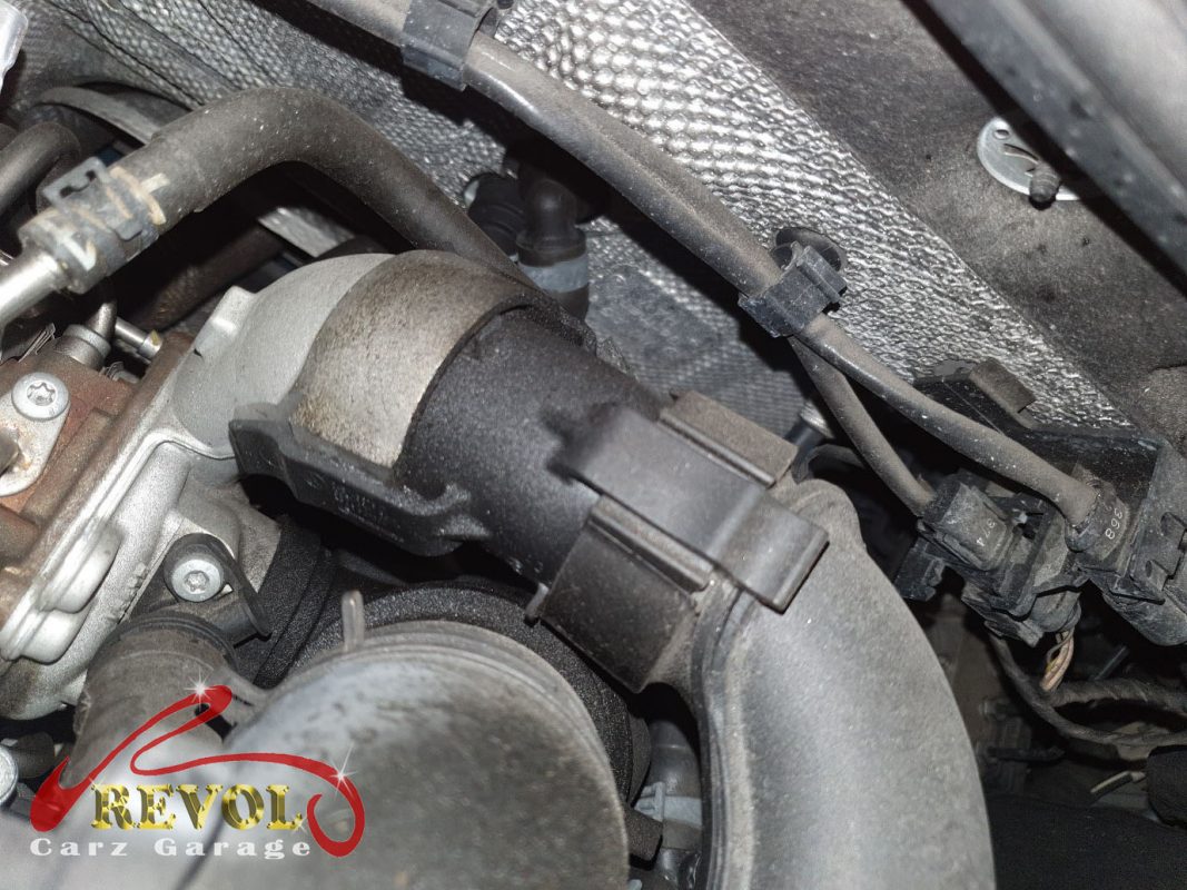 The new genuine VW-spec turbo charge air hose and clamp ready to fit.
