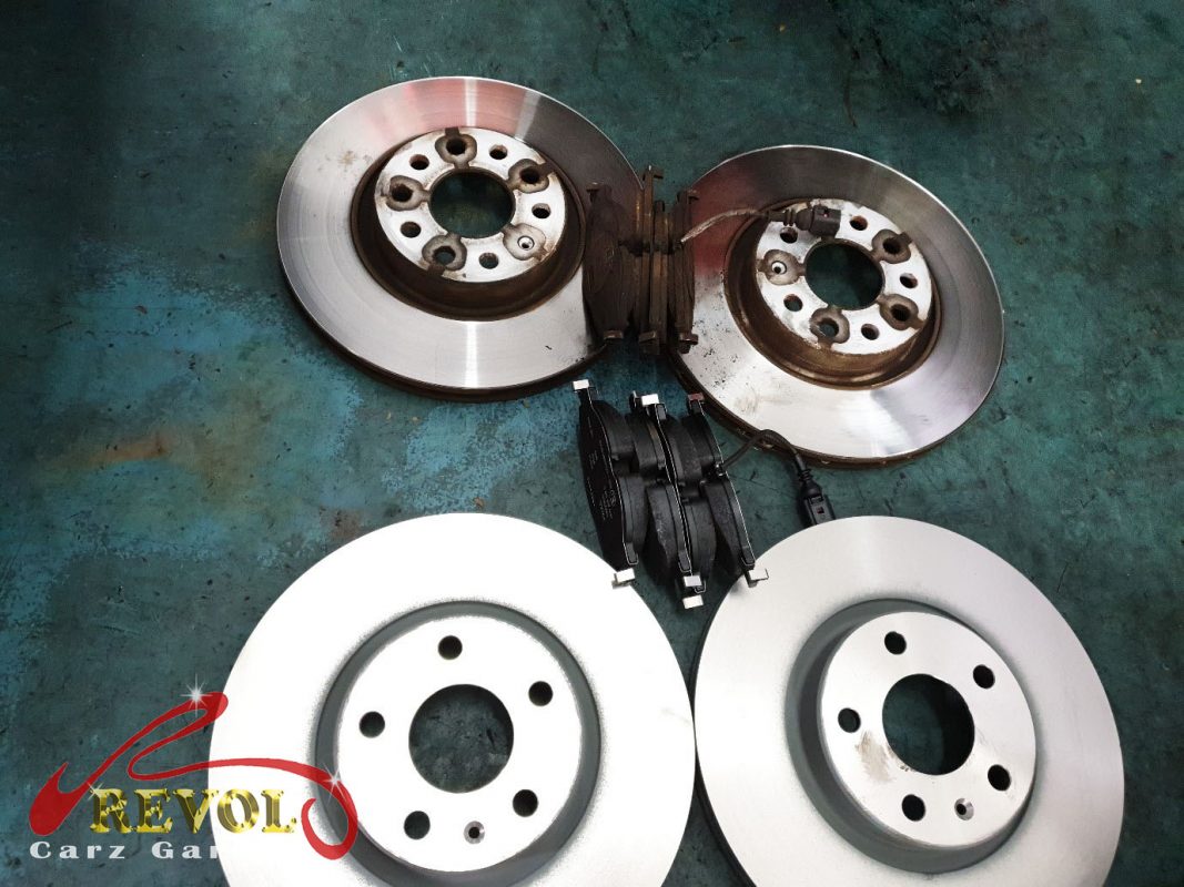 The new front brakes installed and the calipers serviced.
