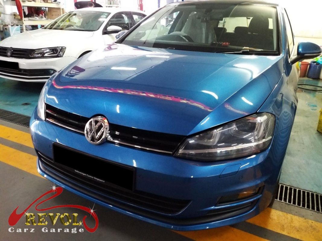 Volkswagen Golf parked at the workshop for a service and front brake replacement.