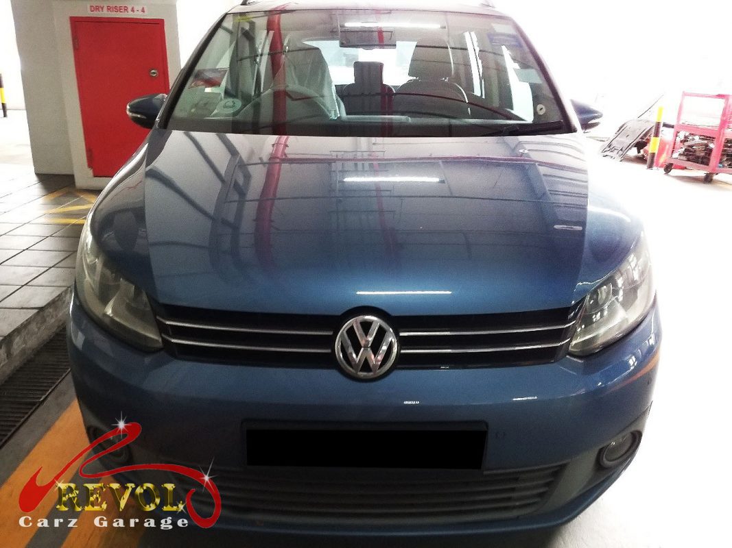 Volkswagen Touran parked at the workshop, in for shock absorber inspection.