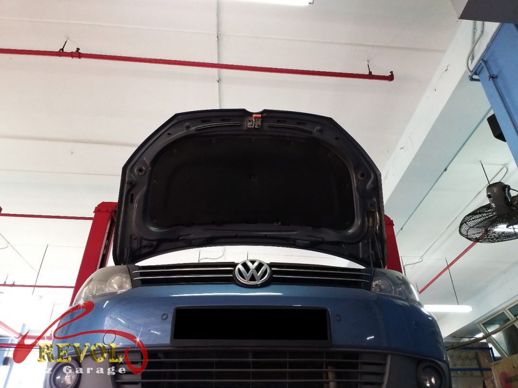 The old front struts removed alongside the new pair.