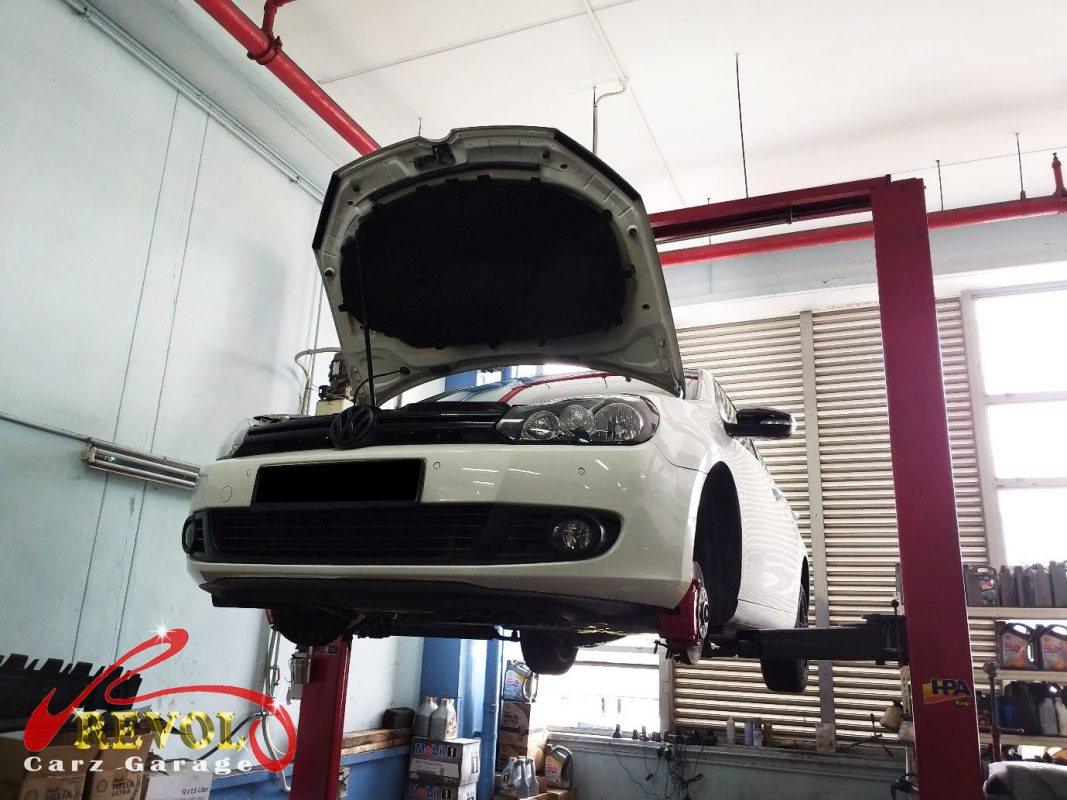The Volkswagen Golf on the lift, the noises tracked to the drop links and a loose cover.