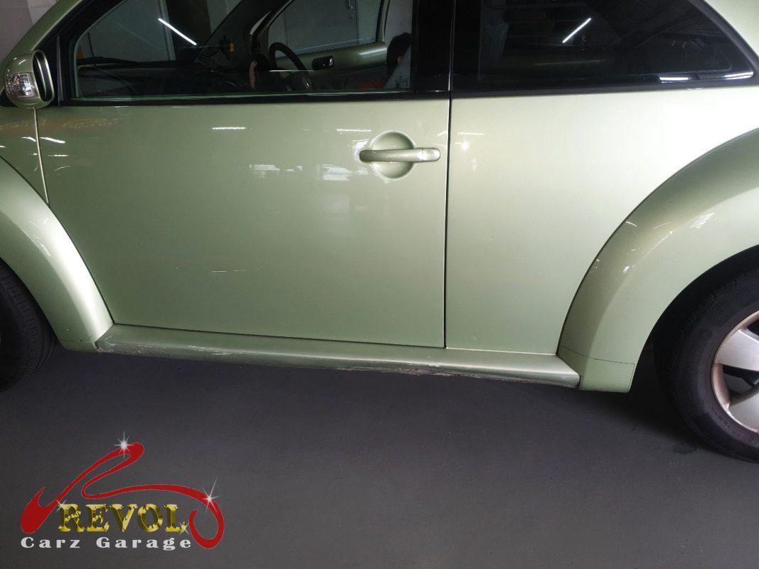 Volkswagen Beetle parked at the workshop, in for a tailgate latch repair.