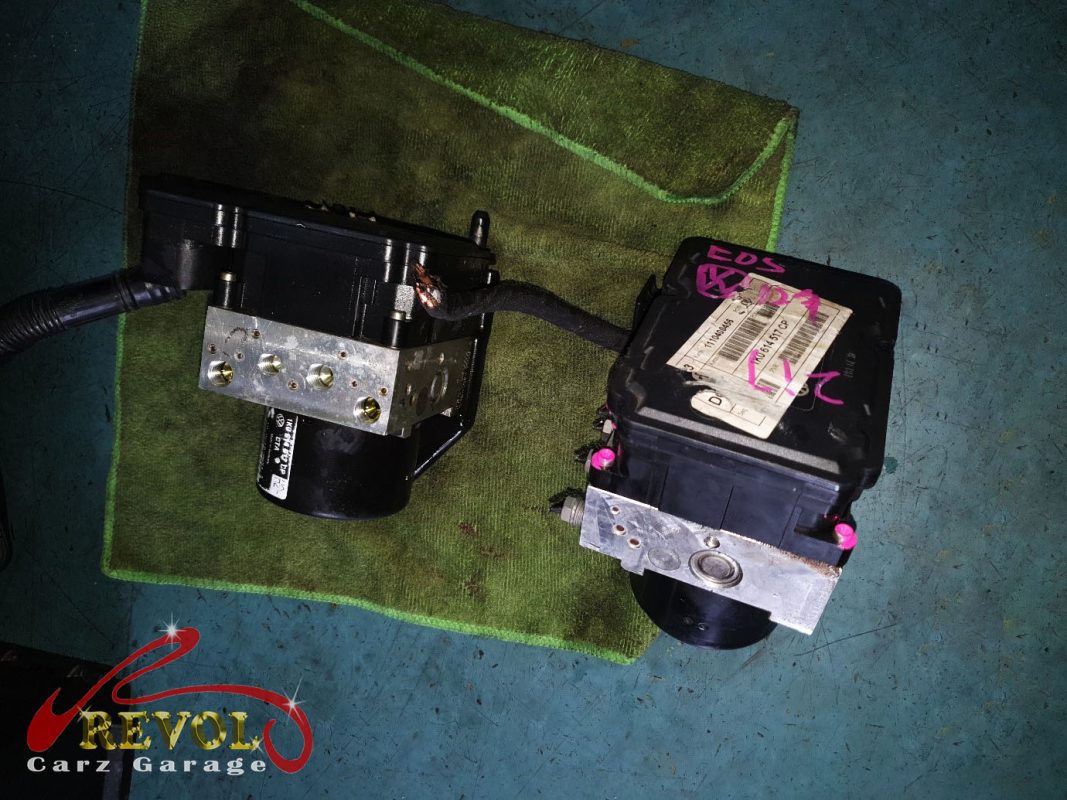 The old failed ABS pump module removed.