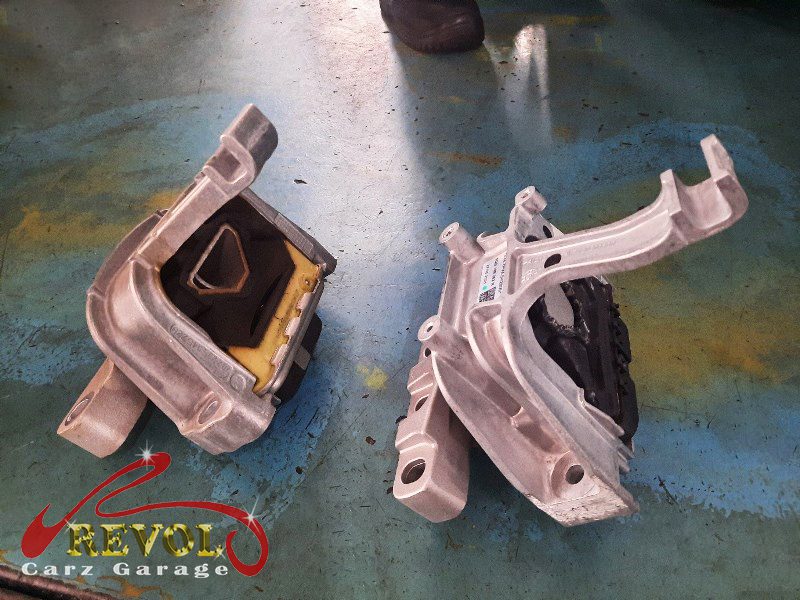 The gearbox mount removed showing the play under load.