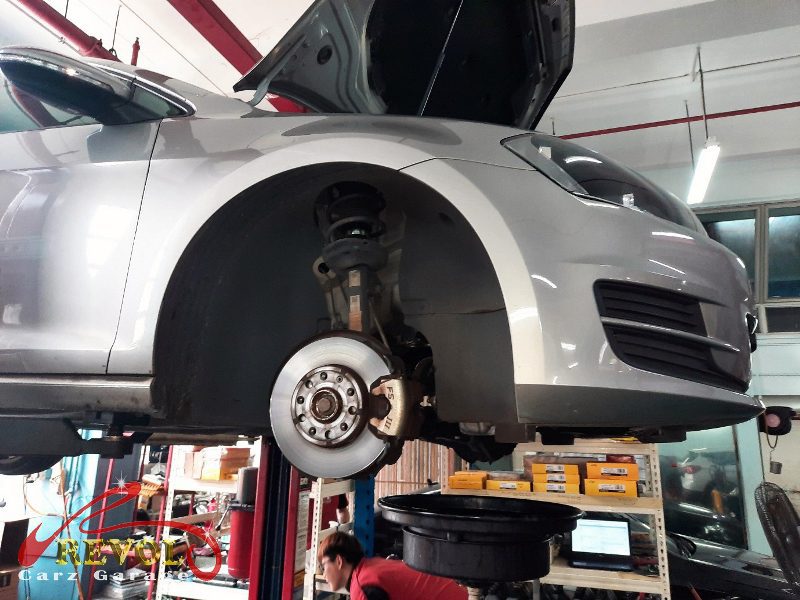 The old front discs removed alongside the new set.