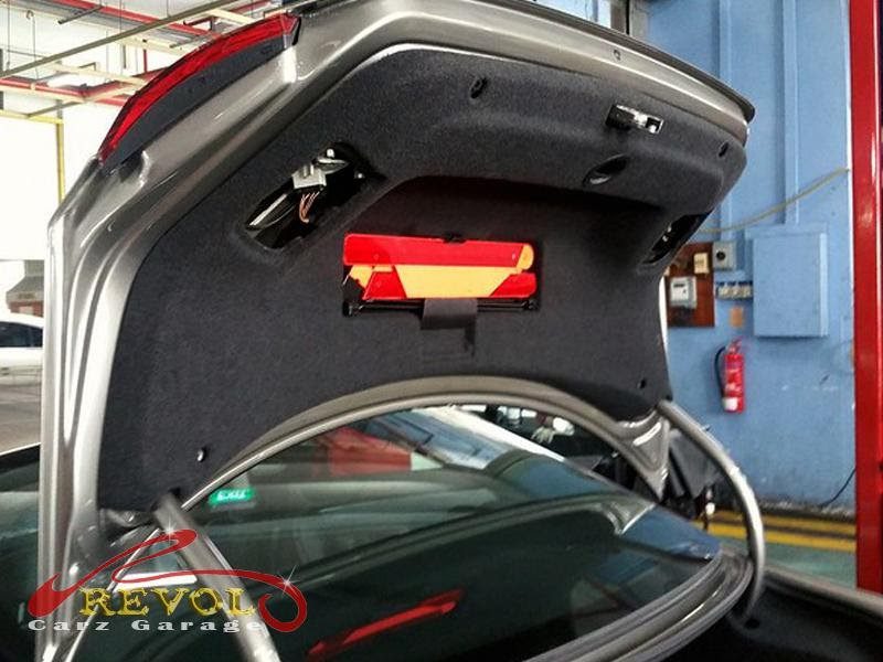 The boot opened and the trim off the Volkswagen showing the failed latch mechanism.
