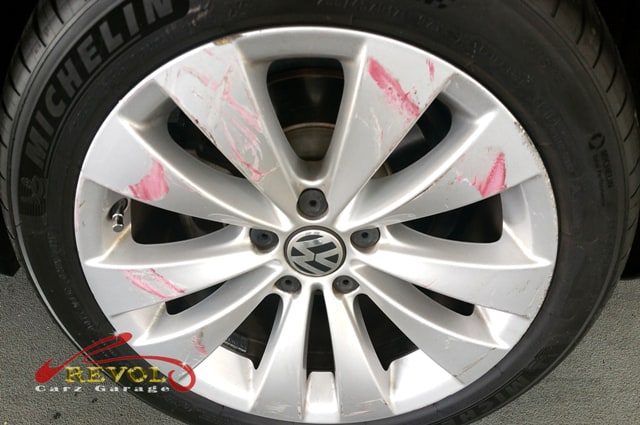 The Volkswagen Passat side-swipe damage assessed for the insurance claim.