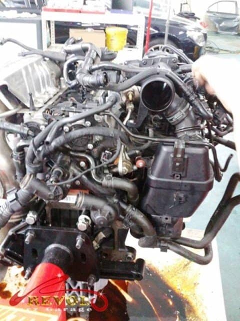 The engine reassembled with the new piston and renewed parts.