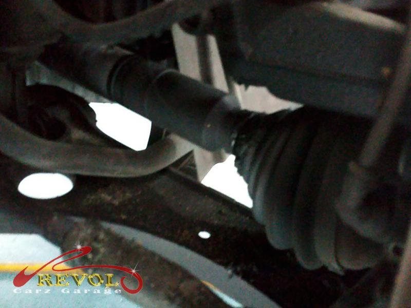 The split CV boot spotted on the Volkswagen Golf drive shaft, grease flung around the arch.