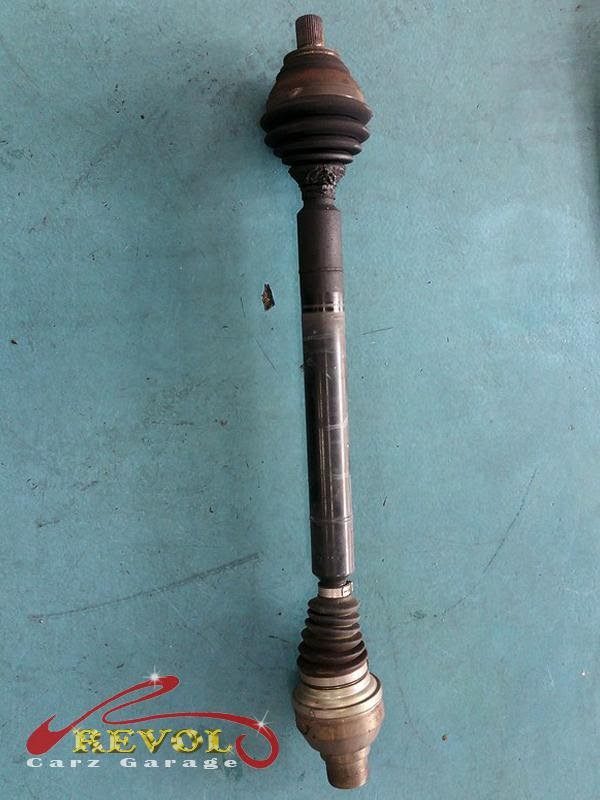 The failing drive shaft removed from the front of the car.