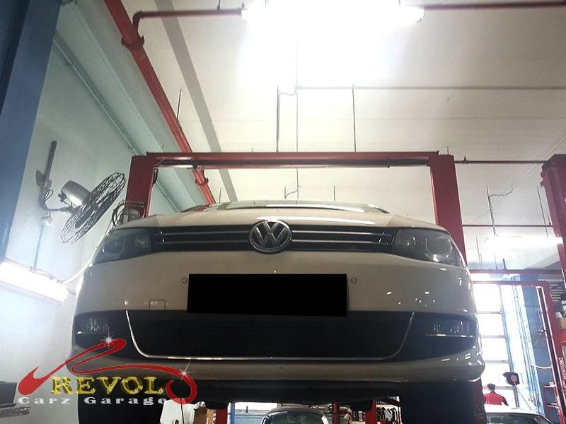 The front suspension checked on the lift, finding play in the control arms.