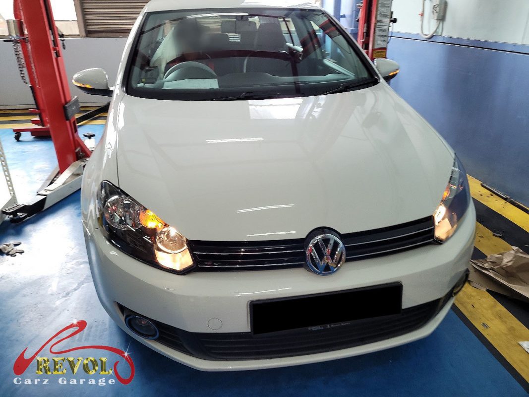 Volkswagen Golf parked at the workshop for a high-mileage service and repairs.